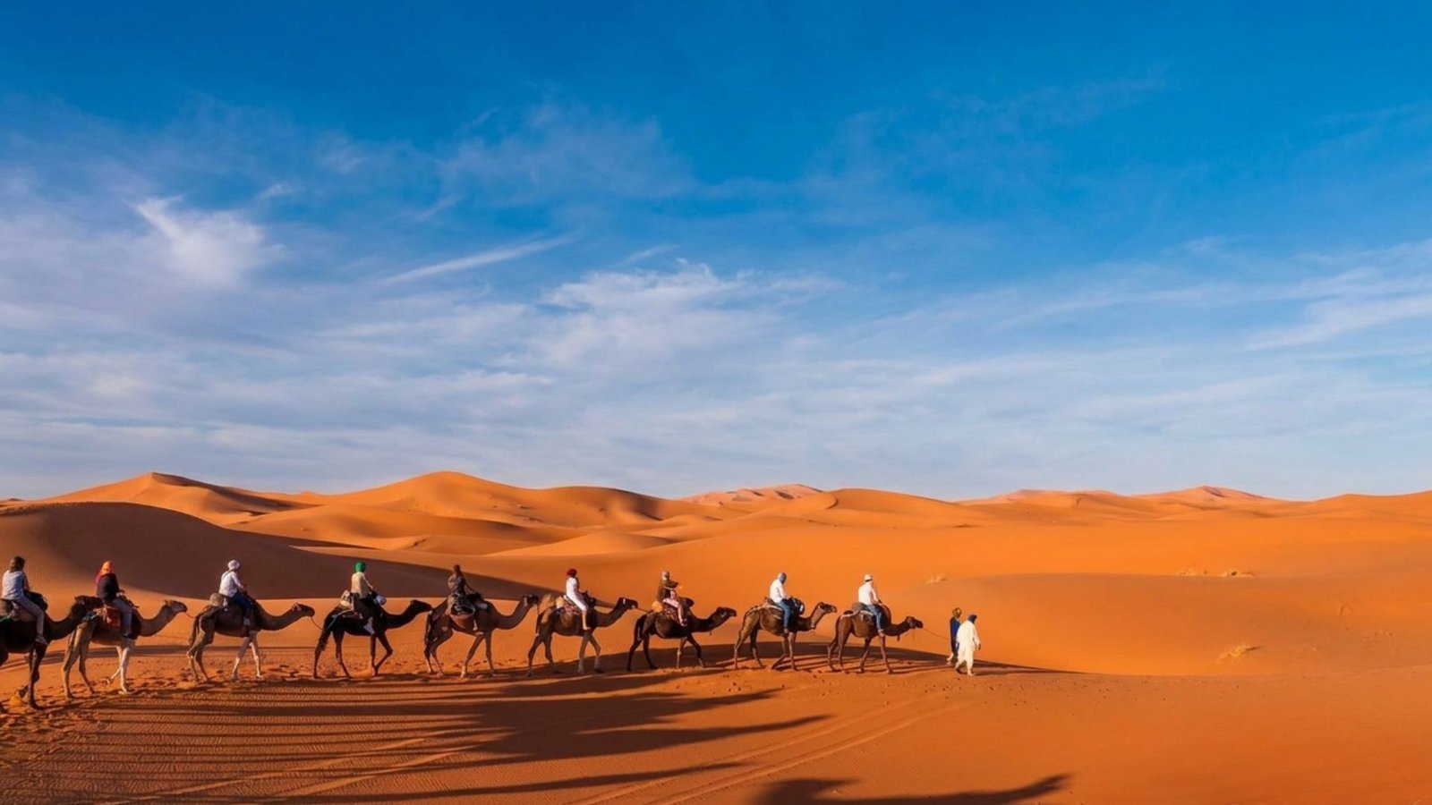 Sahara desert luxury camp dunes at sunset